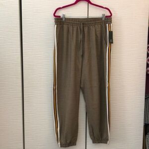 NWT Wild Fable brown/black houndstooth joggers with racing stripes on each leg.